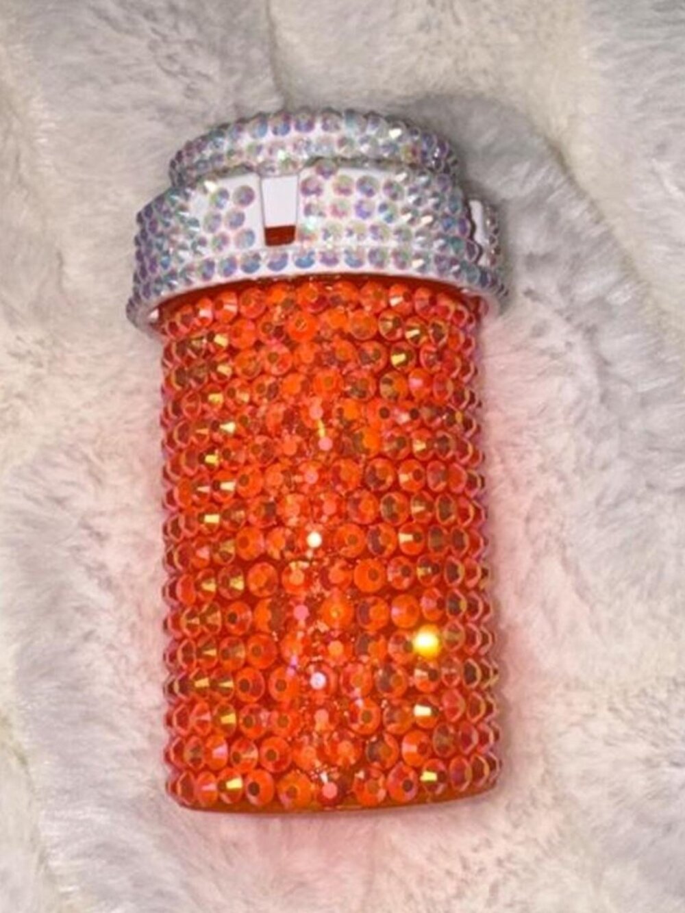 Orange rhinestone bottle with silver cap